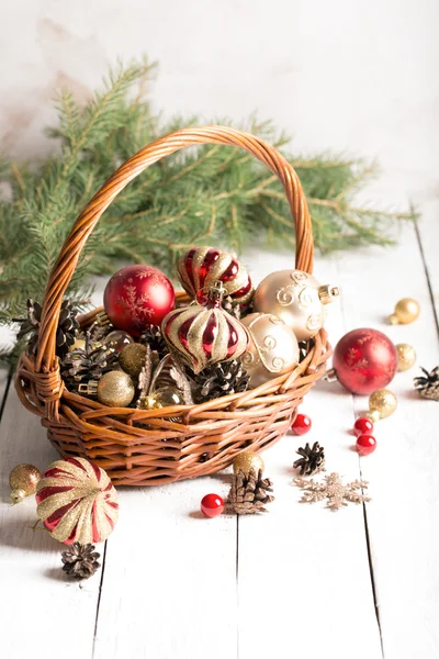 Christmas basket with red and golden ornaments
