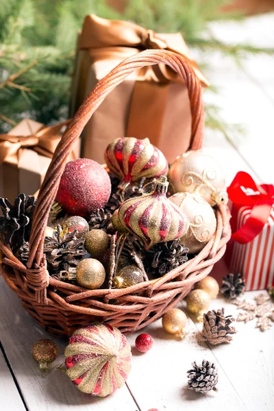 Christmas basket with red and golden ornaments,