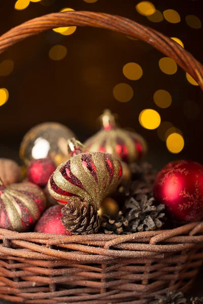 Christmas basket with red and golden ornaments