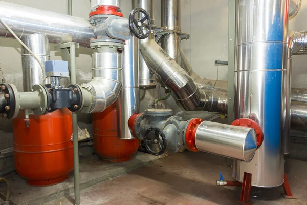 Valves and plumbing pipes in the boiler room