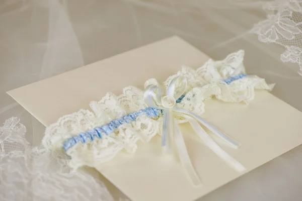 Wedding invitation with a wedding garter