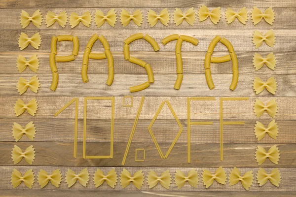 Pasta  ten percent off text made of raw pasta