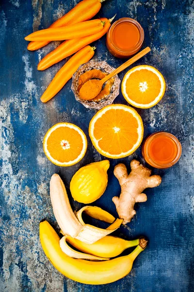 Carrot ginger immune boosting, anti inflammatory smoothie with turmeric and honey. Detox morning juice drink, clean eating