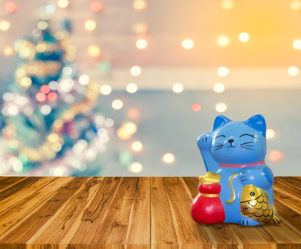 Lucky cat bank with Christmas background,  time to start to savi