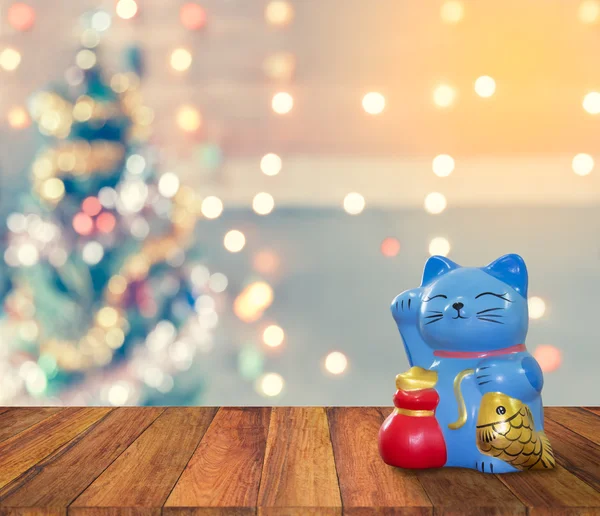 Lucky cat bank with Christmas background,  time to start to savi