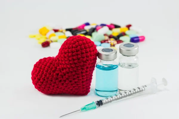 Medicine, vaccine and big red heart