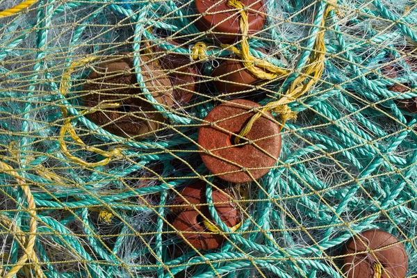 Fishing nets.Fishing nets with large floats. Colorful fishing nets drying on shore. Fishing nets ready for fishing.