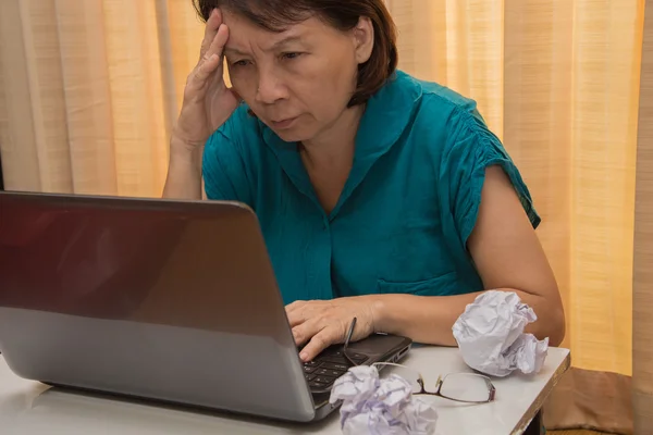Woman old currently working with stress.
