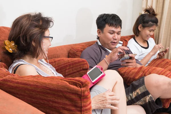 Family playing game on smart phone