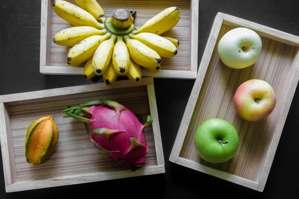 Fresh fruit in wooden boxes