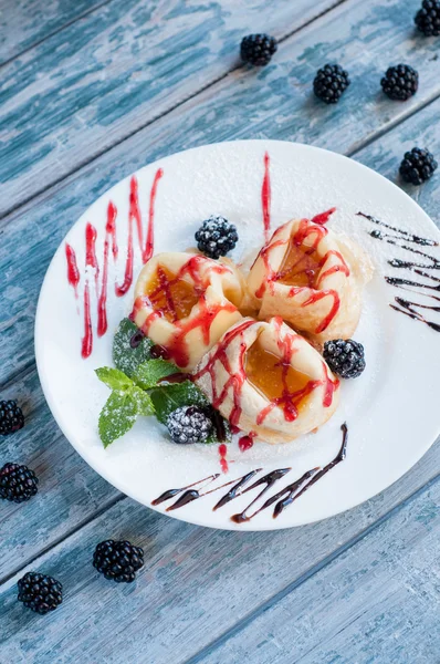 Crepes with jam and blackberries