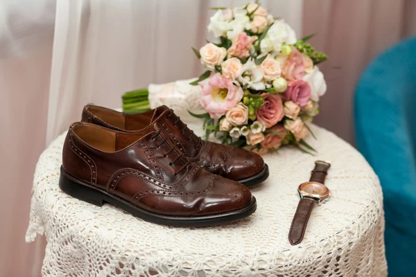Shoes, watches and wedding bouquet