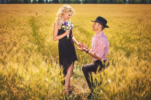 Boyfriend and girlfriend on wheat field