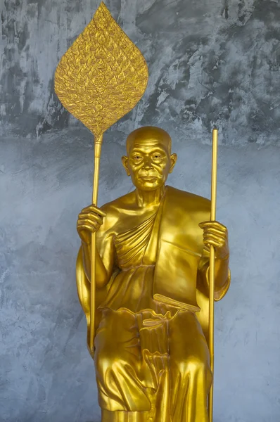 Golden Buddhist Monk Statue