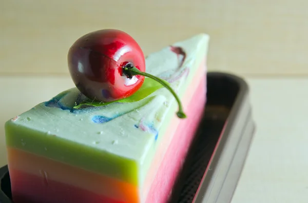 Fancy soap in cake form with cherry on the top with blank space