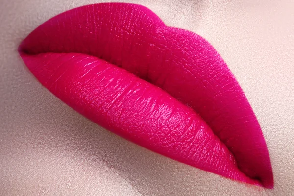 Beautiful full pink lips. Pink lipstick. Gloss lips. Make-up & Cosmetics