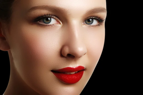 Portrait of elegant woman with red lips. Beautiful young model with red lips. Sexy woman model with bright red lips makeup, and healthy shiny skin. Evening glamour style, fashion make-up