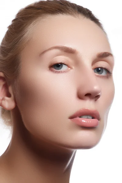 Beautiful face of young adult woman with clean fresh skin - isolated. Beautiful girl with beautiful makeup, youth and skin care concept. Portrait of beautiful young blond woman with clean face. Cosmetics and make-up