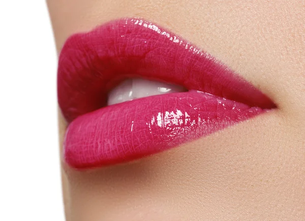 Sexy pink wet lip makeup. Close-up of beautiful full lips. Glossy Lips. Lip Makeup.Beautiful Make-up.Sensual mouth. lipstick or Lipgloss.Professional Facial Makeup closeup