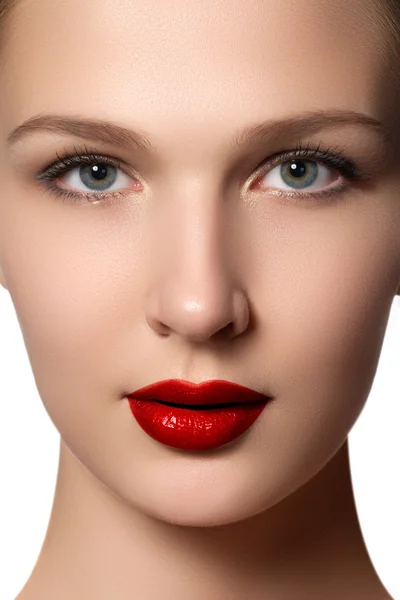 Portrait of elegant woman with red lips. Beautiful young model with red lips. Sexy woman model with bright red lips makeup, and healthy shiny skin. Evening glamour style, fashion make-up