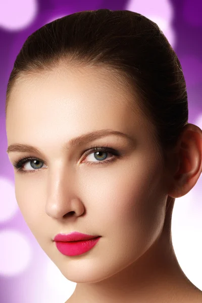 Portrait of elegant woman with pink lips. Beautiful young model with pink lips. Sexy woman model with bright pink lips makeup, and healthy shiny skin. Evening glamour style, fashion make-up