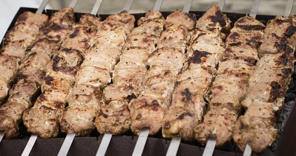 Fried meat on outdoor grill