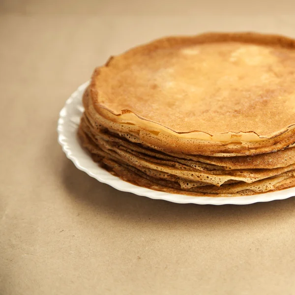 Russian taste pancakes on wooden table