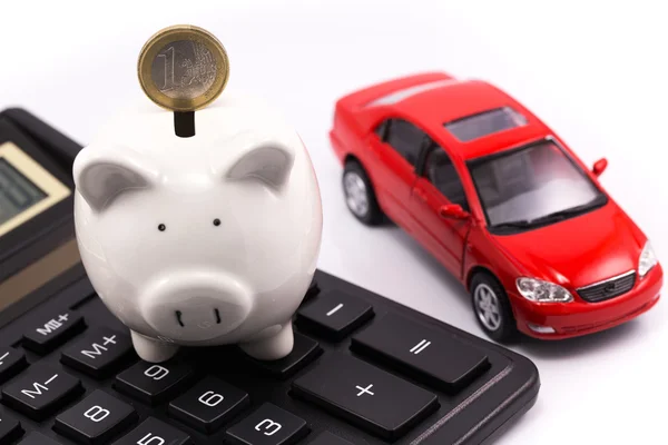 Piggy bank, euro, calculator and car