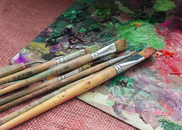 Artist brush and palette with paints oil painting impressionism
