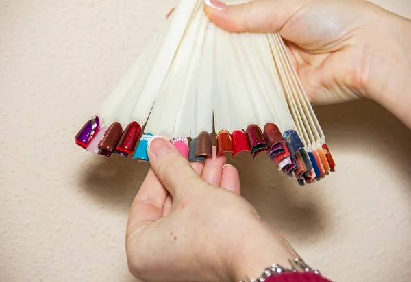 Manicure, nail gel and select the color, nail, applying a colore