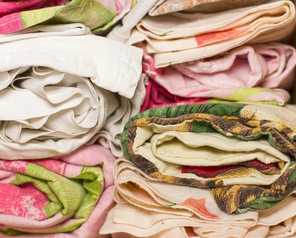 Bedding rolls piled stacks in a closet, cabinet furniture for ho