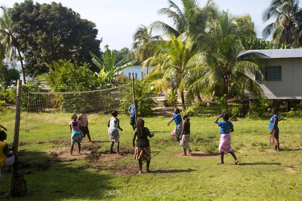 Village women playing volleyball, Solomon Islands