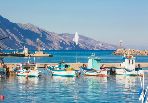 Greece. Boats and ship moored to a pier