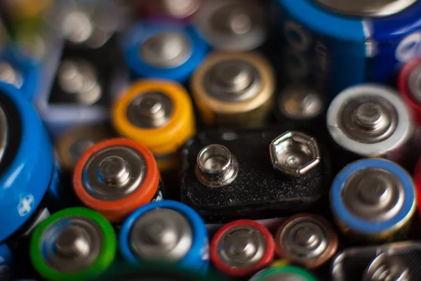 Color batteries of different sizes on a white background isolate