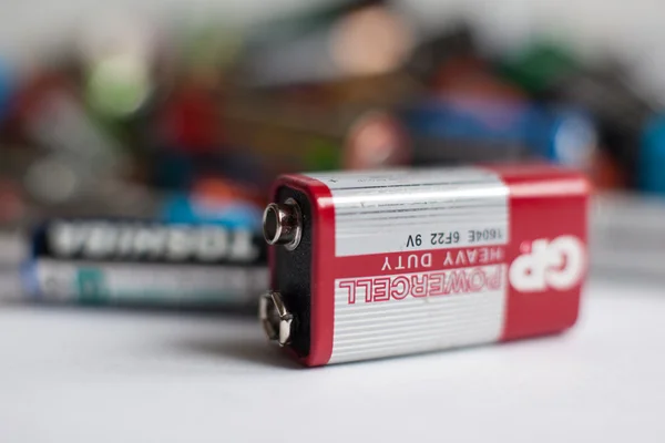 Color batteries of different sizes on a white background isolate