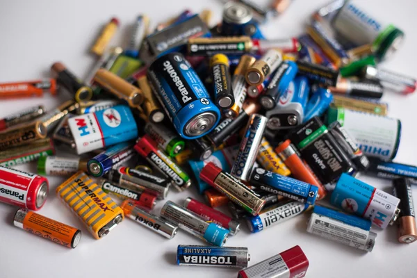 Color batteries of different sizes on a white background isolate