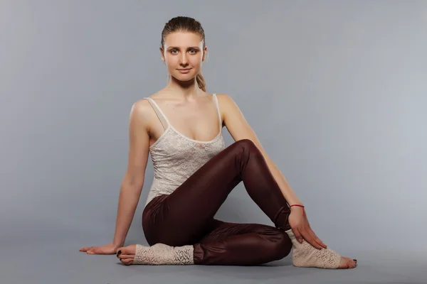 Beautiful young woman posing in studio. Yoga