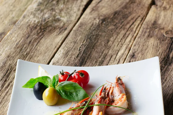Mediterranean cuisine. shrimps and vegetables