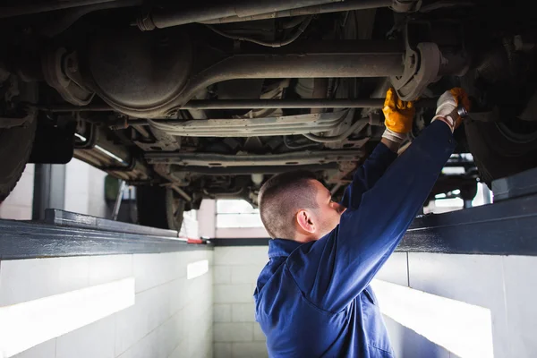 Suspension system of SUV restoration in garage