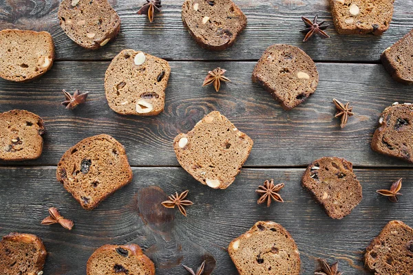 Sweet rye bread slices on wooden table, flat lay