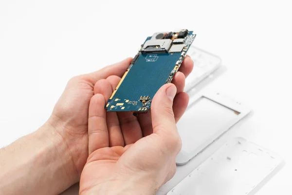 Smartphone dismantling on white background