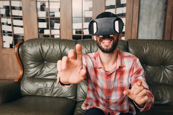 Man touching invisible keyboard in vr glasses