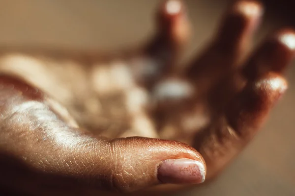 Golden human palm close-up