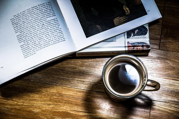 Cup of coffee and books