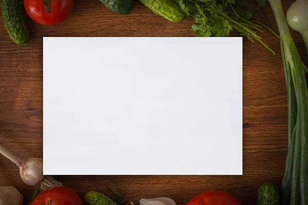 Vegetables on the table with paper on the center