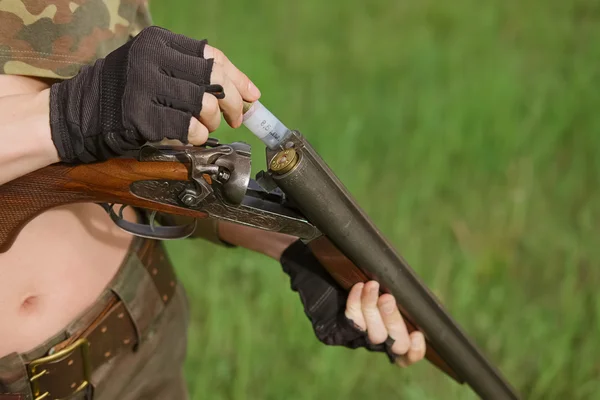 Process of loading shotshell into hunting double-barreled rifle