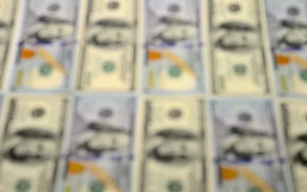 Blur background of hundred-dollar bills
