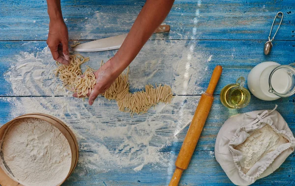 Cook woman preparing Italian pasta