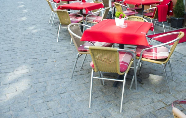 Empty tables in street cafe