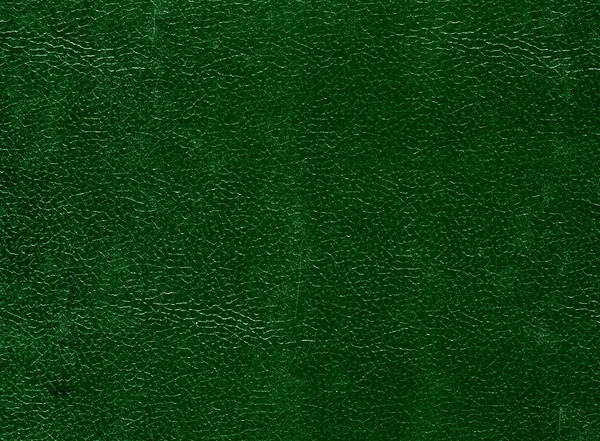 Dark green leather surface.